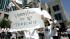 Members of the Hmong community call for the...