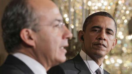 President Barack Obama listens as Mexicos President Felipe Calderon speaks during their joint news conference