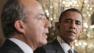 President Barack Obama listens as Mexicos President Felipe Calderon speaks during their joint news conference