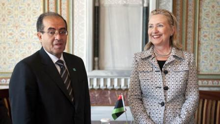 U.S Secretary of State Hillary Rodham Clinton reacts with Mahmud Jibril, Chairman of the Libyan Interim National Transitional Council, during the fourth Libya Contact Group Meeting in Istanbul
