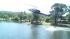 Helicopter picks up a load of water to drop on a...