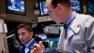 Traders work on the floor of the New York Stock Exchange on Wednesday, Aug. 3, 2011, in New York.