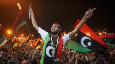 People celebrate the capture in Tripoli of Moammar Gadhafis son and one-time heir apparent, Seif al-Islam, at the rebel-held town of Benghazi, Libya, early Monday, Aug. 22, 2011.