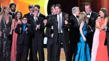 cast and crew of Modern Family accept the award for outstanding comedy series