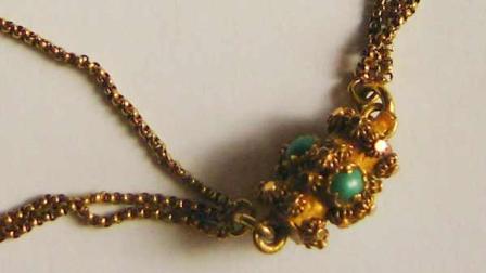 In this undated photo made available Monday Sept. 19, 2011, showing the gold-plated necklace which was recovered from the wreckage of the Titanic, which has been stolen from a display at Copenhagens Tivoli amusement park. Park spokesman Torben Planks says the jewelry disappeared Saturday morning, but the alarm did not sound and police are investigating the theft of the necklace. The necklace was owned by first class passenger Eleanor Wildener of Philadelphia who survived the Titanic sinking, and is valued at about 14,000 euro (US dlrs 19,300). (AP Photo/POLFOTO)