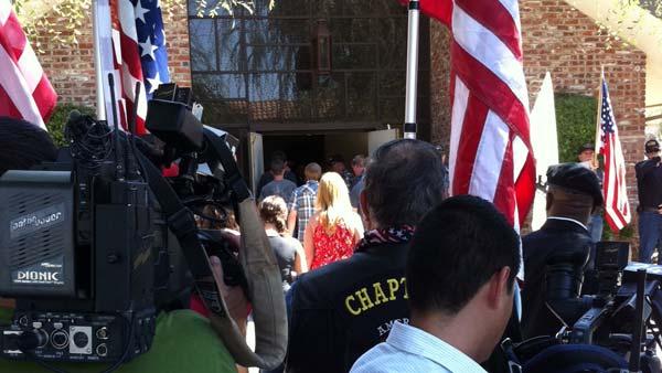 Television crews gather outside Myers Funeral Home.