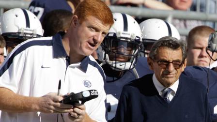 In this Oct. 8, 2011 file photo, Penn St. assistant football coach Mike McQueary, left, talks with head coach Joe Paterno during an NCAA college football game against Iowa, in State College, Pa. Penn State Athletic Director Tim Curley and Gary Schultz, the schools senior vice president for business and finance, face arraignment Monday, Nov. 7, 2011, on charges they lied to a grand jury investigating former defense coordinator Jerry Sandusky and failed to properly report suspected child abuse, a case that has left fans reeling. In 2002, State Attorney General Linda Kelly said, a graduate assistant, identified by two people familiar with the investigation as McQueary, saw Sandusky sexually assault a naked boy, estimated to be about 10 years old, in a team locker room shower.