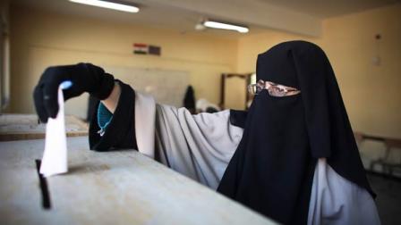 A veiled Egyptian woman casts her ballot in Maadi, a suburb of Cairo, Egypt, Monday, Nov. 28, 2011. Voting began on Monday in Egypts first parliamentary elections since longtime authoritarian leader Hosni Mubarak was ousted in a popular uprising nine months ago. The vote is a milestone many Egyptians hope will usher in a democratic age after decades of dictatorship.