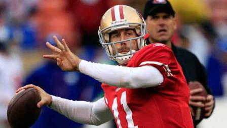 In this Jan. 22, 2012 file photo, San Francisco 49ers quarterback Alex Smith (11) warms up as head coach Jim Harbaugh watches before the NFC Championship NFL football game against the New York Giants
