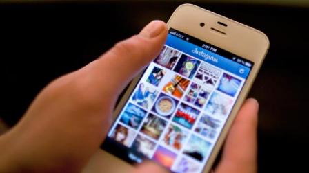 Facebook is spending $1 billion to buy the photo-sharing company Instagram in the social networks largest acquisition ever.