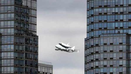 Space shuttle Enterprise, riding on the back of the NASA 747 Shuttle Carrier Aircraft, cruises over the Hudson river, Friday, April 27, 2012 in New York.