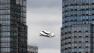 Space shuttle Enterprise, riding on the back of the NASA 747 Shuttle Carrier Aircraft, cruises over the Hudson river, Friday, April 27, 2012 in New York.