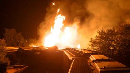 Flames rise from a derailed freight train early Wednesday July 11, 2012 in Columbus, Ohio.