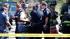 Colorado Movie Theater Shooting 4PM Coverage :: Police and firefighters gather in front of an apartment where the suspect in a shooting at a movie theatre lived in Aurora, Colo., Friday, July 20, 2012. As many as 12 people were killed and 50 injured at a shooting at the Century 16 movie theatre in Aurora, Colo., Friday, July 20, 2012. The suspect is identified as 24-year-old James Holmes. (AP Photo/Ed Andrieski)