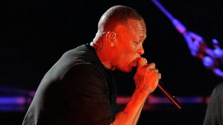 Eminem, right, appears onstage to perform with Dr. Dre during the headlining performance by Dre and Snoop Dogg on the first weekend of the 2012 Coachella Valley Music and Arts Festival, Sunday, April 15, 2012, in Indio, Calif. (AP Photo/Chris Pizzello)