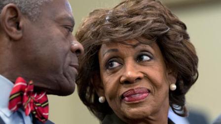 Rep. Maxine Waters, D-Calif., smiles at her husband, Sidney Williams