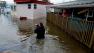 Andrea Grolon walks through waist-deep water in the Metropolitan Trailer Park in Moonachie, N.J. on Tuesday, Oct. 30, 2012.