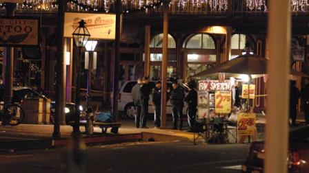 In this image provided by Robert Petersen police inspect the scene of a shooting outside the Sports Corner Cafe in Sacramento Calif.