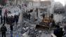 people gather around destroyed buildings after airstrikes hit areas in Aleppo, Syria.