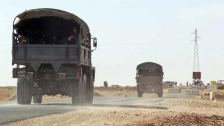 Algerian army trucks are seen near Ain Amenas, the gas plant where the hostage taking occured, Sunday Jan. 20, 2013.