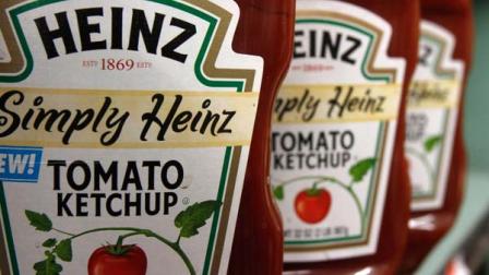 FILE - In this March 2, 2011 file photo, Heinz ketchup is seen on the shelf of a market in Barre, Vt. H.J. Heinz Co. says it agreed to be acquired by an investment consortium including billionaire investor Warren Buffett in a deal valued at $28 billion.