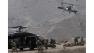 U.S. Black Hawk helicopters arrive to the scene after a NATO helicopter crashed in a field killing two American service members, near Gerakhel, eastern Afghanistan, Tuesday, April 9, 2013.