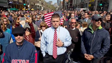 A moment of silence in honor of the victims of the Boston Marathon bombing is observed on Boylston Street near the race finish line, exactly one week after the tragedy, Monday, April 22, 2013, in Boston, Mass.
