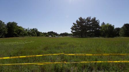 Crime scene tape surrounds the scene in Oakland Township, Mich., Monday, June 17, 2013 where officials search for the remains of Teamsters union president Jimmy Hoffa who disappeared from a Detroit-area restaurant in 1975.