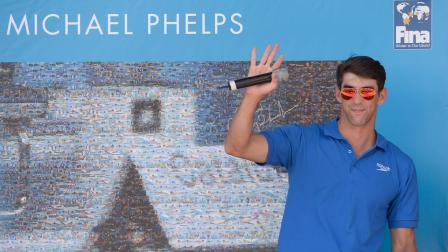 Former Olympic and world swimming champion Michael Phelps of the US attends the unveiling of a mosaic installed in his honour at the FINA Swimming World Championships in Barcelona, Spain, Sunday, July 28, 2013.