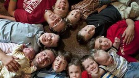 In this Aug. 6, 2013, photo, the 12 Schwandt brothers pose for a photo in their home in Rockford, Mich.