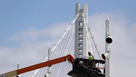 This photo taken Thursday, Aug. 1, 2013 shows a worker on the new eastern section of the San Francisco-Oakland Bay Bridge in San Francisco.