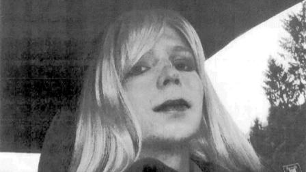 FILE - In this undated file photo provided by the U.S. Army, Pfc. Bradley Manning poses for a photo wearing a wig and lipstick.
