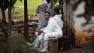 A morgue worker waits outside in the grounds of the mortuary in Nairobi, Kenya Wednesday, Sept. 25, 2013.