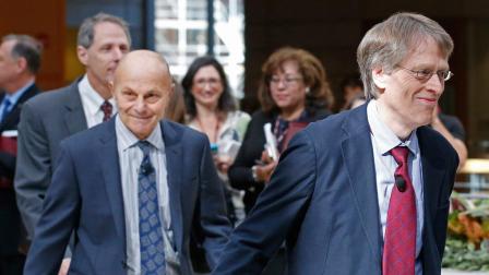Nobel Prize winners Lars Peter Hansen, 60, right, and Eugene Fama, 74, left, of the University of Chicago arrive at a news conference Monday, Oct. 14, 2013, in Chicago, after being named two of the three winners of the Nobel Prize for Economics.