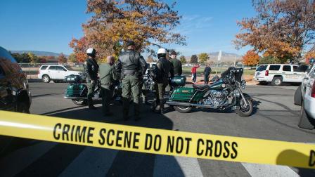 Police secure the scene near Sparks Middle School after a shooting in Sparks, Nev., on Monday, Oct. 21, 2013. Authorities are reporting that two people were killed and two wounded at the Nevada middle school.