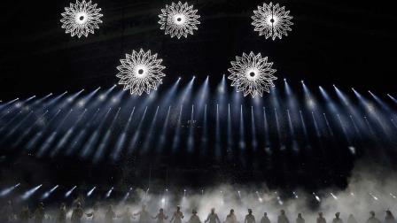 Artists perform as snow flakes start forming the Olympic rings during the opening ceremony of the 2014 Winter Olympics in Sochi, Russia, Friday, Feb. 7, 2014.
