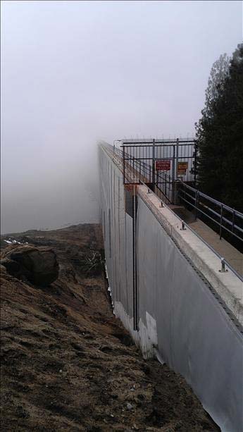 View of the Shaver Lake dam as a low cloud moves...