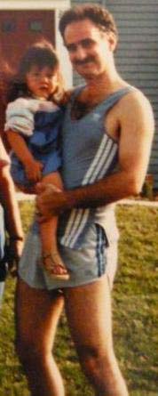 Ed Bataller with little David at a cycling...