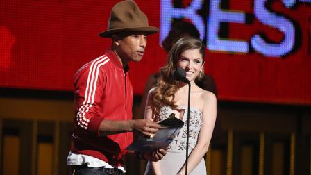 FILE - In this Jan. 26, 2014 file photo, Pharrell Williams, left, and Anna Kendrick present the award for best new artist at the 56th annual Grammy Awards at Staples Center in Los Angeles.