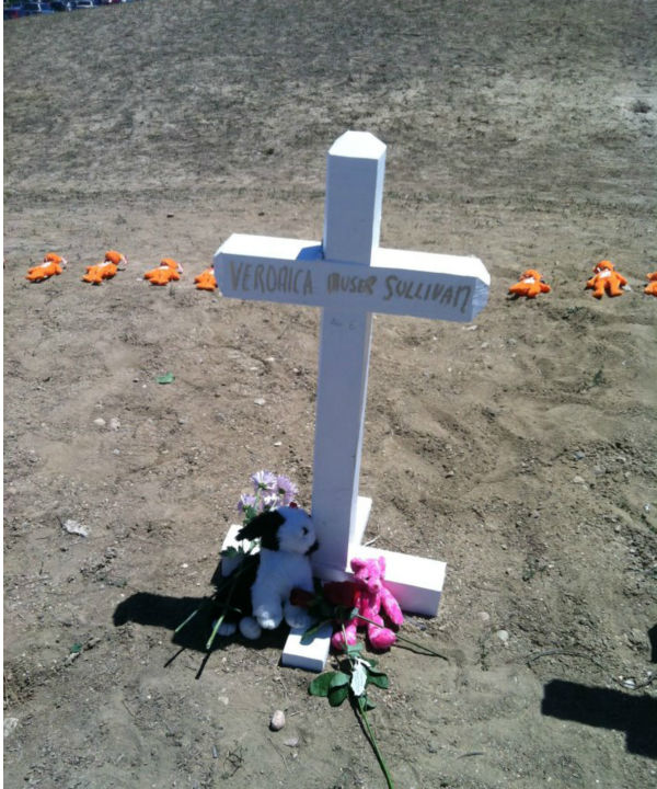 A cross for the youngest victim, 6-year-old...