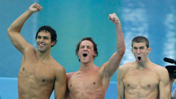 U.S. swimmers, from left, Ricky Berens, Ryan Lochte and Michael Phelps celebrate winning the gold medal as they set a new world record in the mens 4x200-meter freestyle relay final during the swimming competitions in the National Aquatics Center at the Beijing 2008 Olympics in Beijing, Wednesday, Aug. 13, 2008.