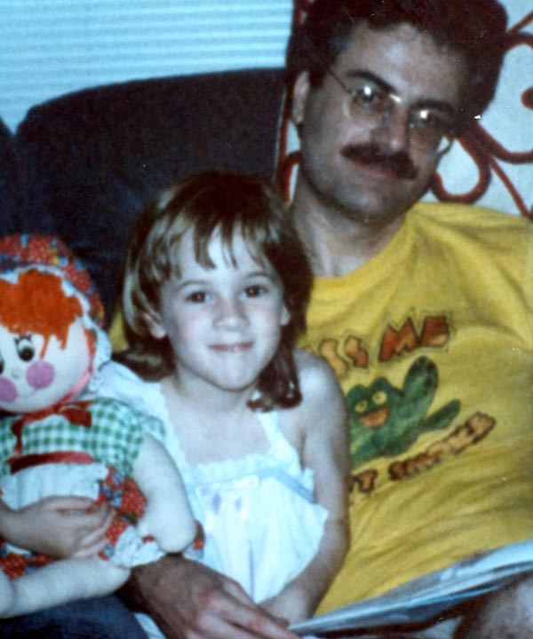 Stephanie Stone in 1985, reading to Raggedy Ann...
