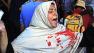 An Egyptian woman with blood on her clothes screams during clashes between security forces and supporters of Egypts ousted President Mohammed Morsi in Ramses Square, in downtown Cairo, Egypt, Friday, Aug. 16, 2013.
