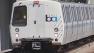 Bart train pulling into a station.