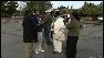group of people standing in parking lot