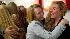 Passengers are embraced by relatives, as they return from Palma de Mallorca, Spain, at Tegel airport in Berlin, Tuesday, April 20, 2010.