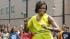 First lady Michelle Obama dances with students...