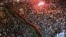 Gadhafi son resurfaces, free and vowing to fight