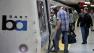 In this Aug. 26, 2011 photo, commuters get onboard a Bay Area Rapid Transit (BART) train at the Civic Center stop in San Francisco.