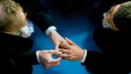 **FILE** In this file photo from June 17, 2008, John Lewis, left, puts a wedding ring on the hand of Stuart Gaffney as they exchange marriage vows at City Hall in San Francisco.